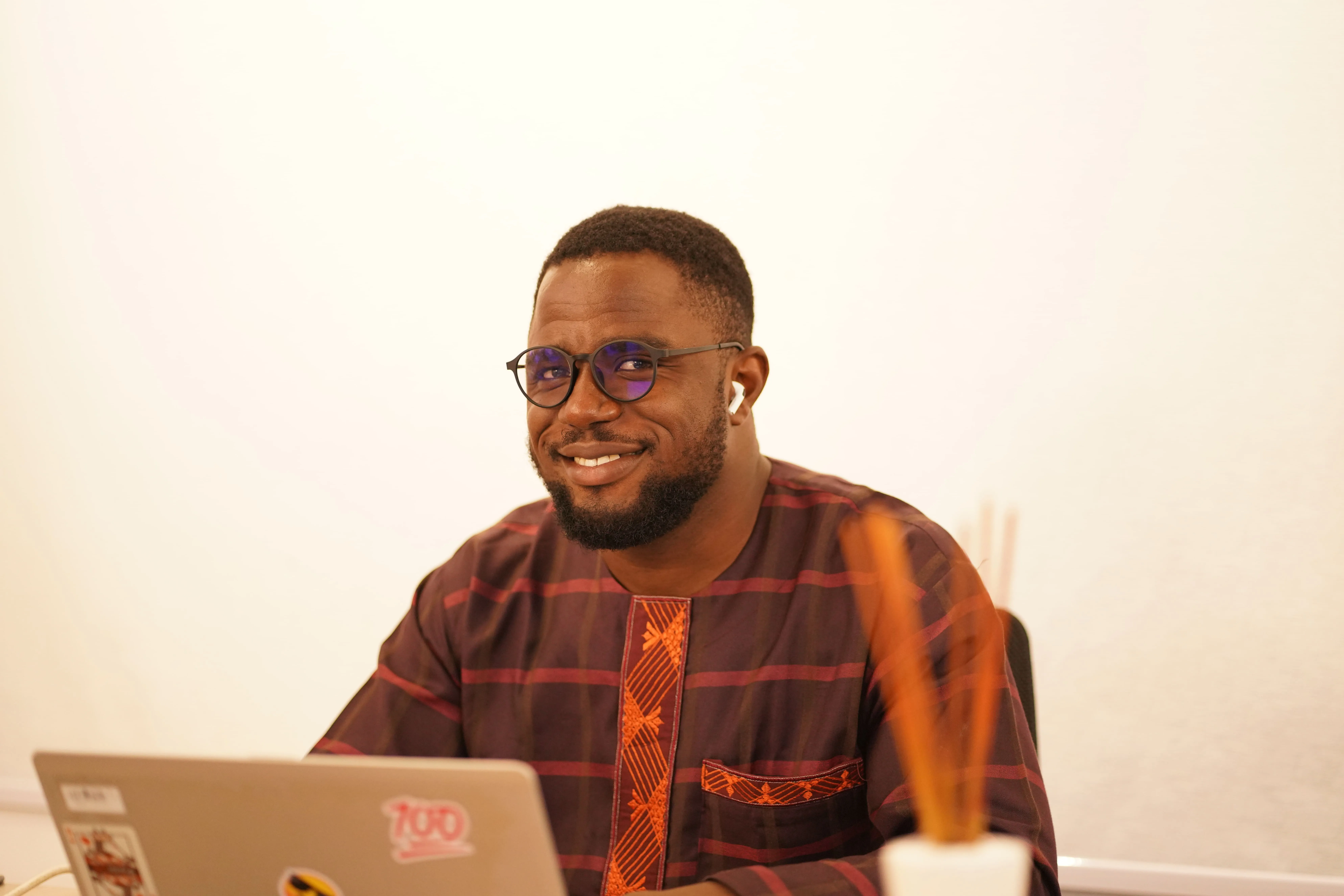 A man sitting in front of a laptop computer.