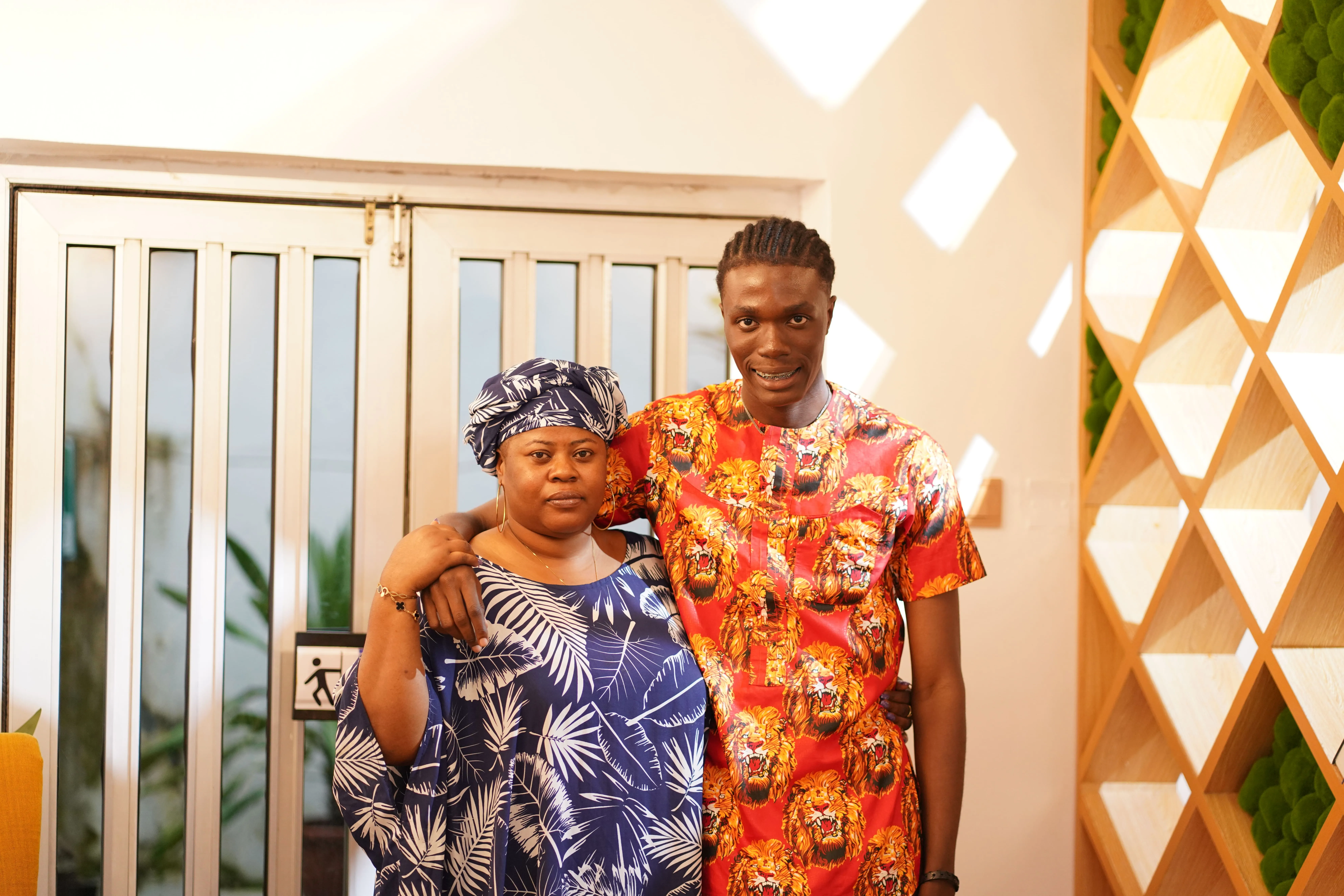 A couple of people standing next to each other.