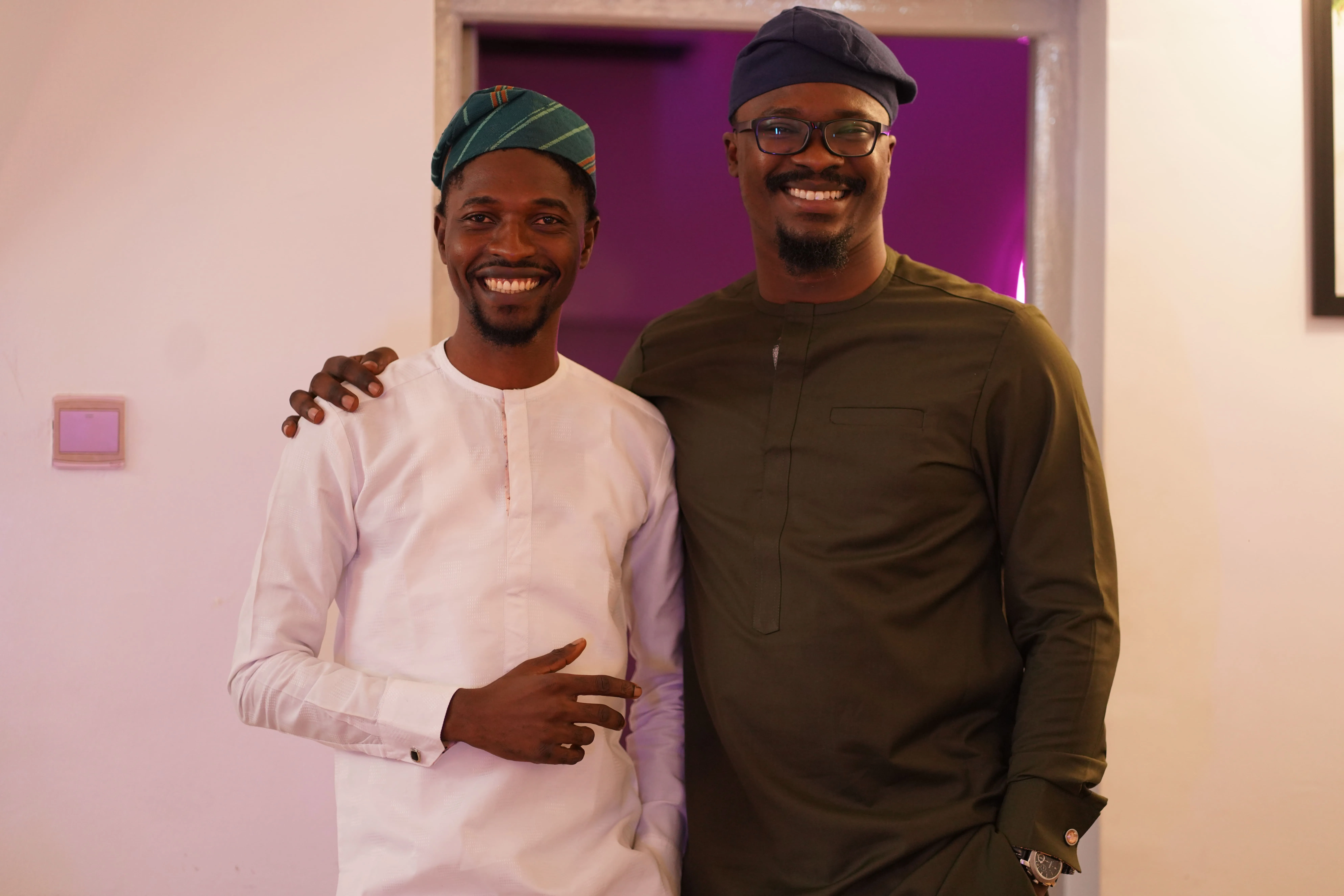 A couple of men standing next to each other.