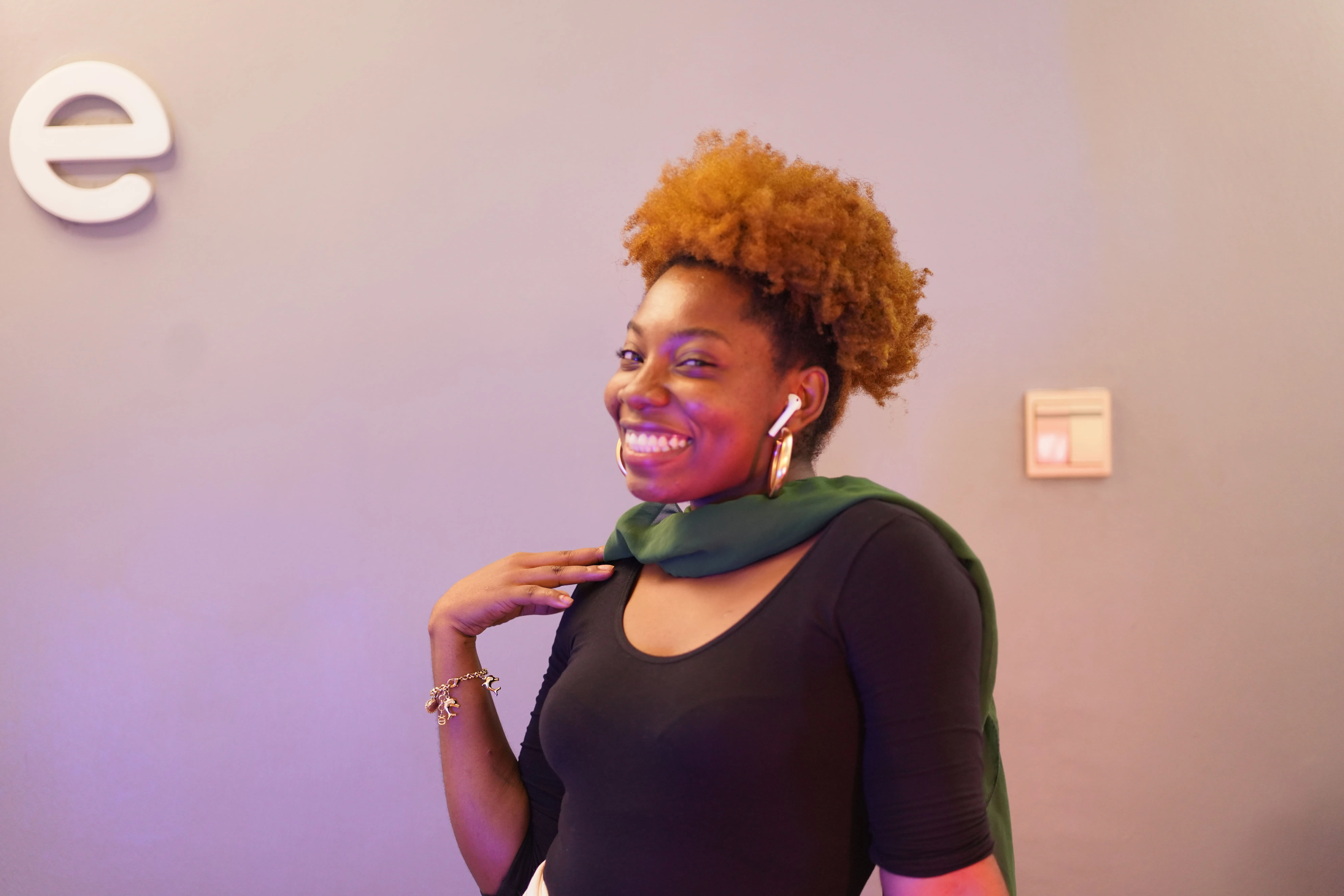 A woman with a scarf around her neck.